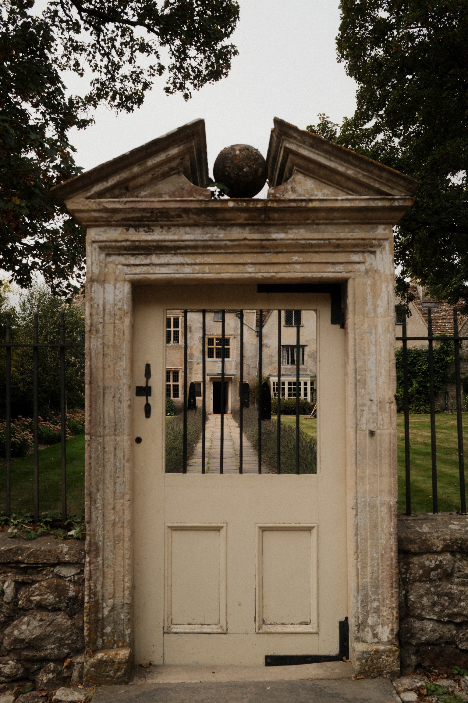 A glazed doorway beneath a stone pediment